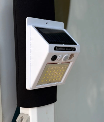 AWNING ARM SECURE STRAPS WITH BUILT IN SOLAR POWERED COMBINATION LIGHT/ALARM